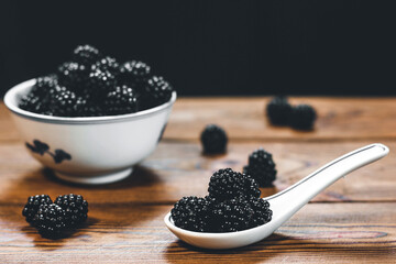 Fototapeta na wymiar Blackberries on a wooden background. Blackberry. Summer small berry