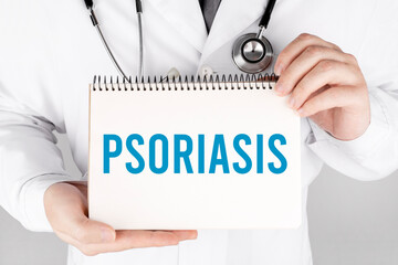 Doctor holding a card with Psoriasis, medical concept