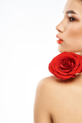 Naklejka premium Portrait of woman with red rose naked shoulders Make-up on brunette face