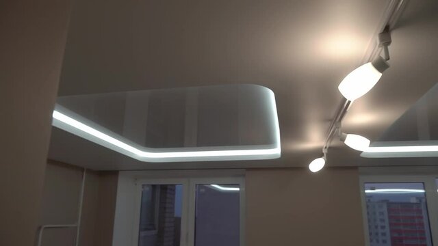 suspended ceilings and plasterboard structures in the decoration of an apartment or house. Dolly video. Led lighting.