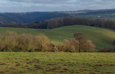 Beautiful landscape view hilly countryside fields with trees and forests
