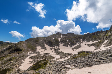 Difficult hiking trail going uphill through the rocks, Pirin mou