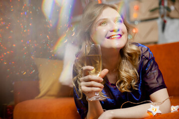Celebrating Woman. Holiday People. Beautiful Girl with perfect Makeup Holding Glass of Champagne