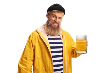 Bearded guy fisherman holding a mug of beer and smiling at camera