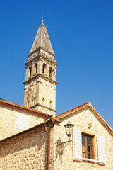 Fototapeta na wymiar Montenegro. Bell Tower of St Nicholas church in ancient town of Perast