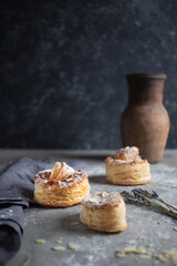 fresh baked goods in powdered sugar on wooden background