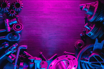 Car spare parts flat lay background. Disassembled car gearbox parts and wrenches on the workbench.