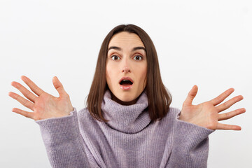 Clueless satisfied young female has spreads hands with hesitation, can not make choice between two...