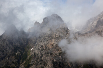 Teton mountains with a storm cloud