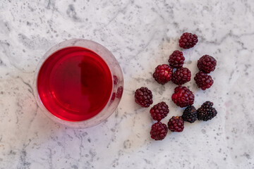 berry juice flatlay on marble