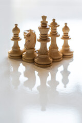 Queen King Knight Bishop Chess Pieces in Triangle Formation