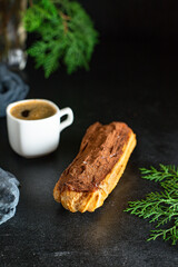 profiteroles eclairs with berry filling and cream custard cake choux pastry portion on the table serving healthy meal snack ingredient top view copy space for text food background rustic