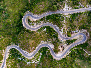 Snake Curves. Aerial view of a road through the mountains. 