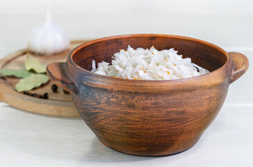 Homemade with carrot and salad cabbage on a wooden table.