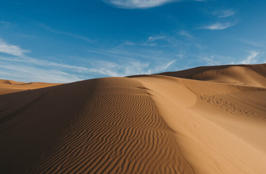 landscape with desert dunes and blue sky