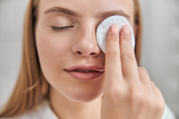 Young female with natural healthy fresh skin at home bathroom