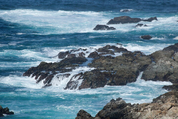 Ocean waves crashing onto a rocky shore