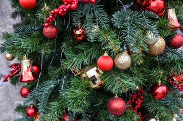 Naklejka na ściany i meble Christmas decoration with balls and garland. European city preparing for winter New Year holidays