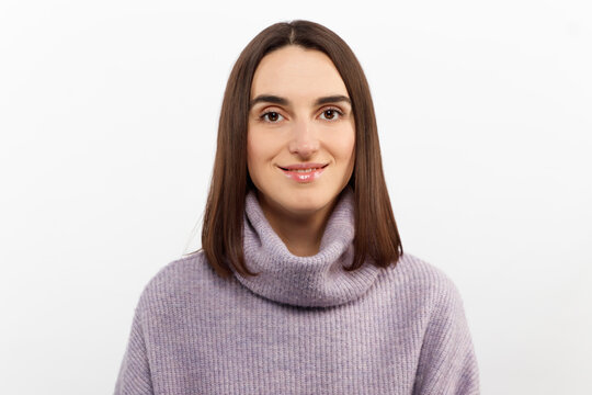 Close-up tender alluring brunette woman with haircut that floats in air, smiling joyfully and coquettish gaze camera, stand white background