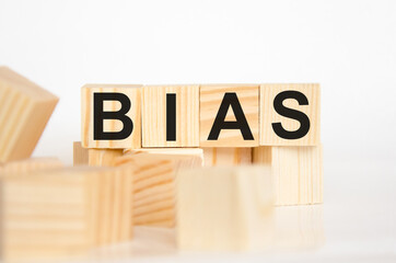 the word bias is written on wooden cubes lying on cubes