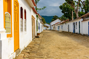 Streets of cobblestone and old houses in colonial style on the streets of the old and historic city of Paraty founded in the 17th century on the coast of the state of Rio de Janeiro, Brazil