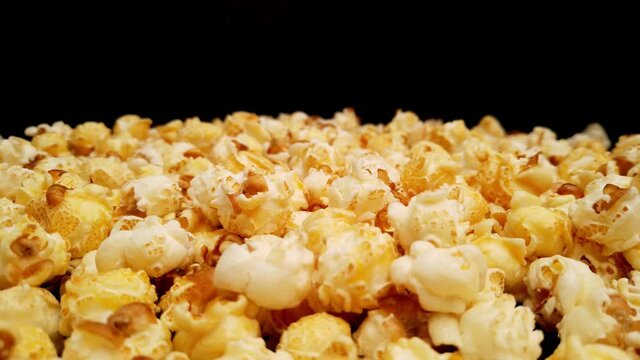 Close up flight over freshly popped popcorn - food photography