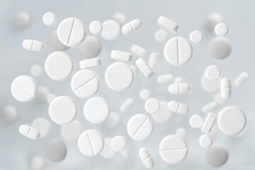 Medical background of floating white pills