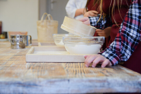 Preparation of ingredients: flour, water, dough for onion flatbread at The regional Museum of Cebularz in Lublin, Poland