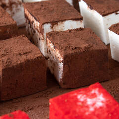 baked goods at home, handmade sweets, chocolate marshmallow coating, close-up, red and brown color, macro