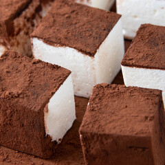 homemade sweets in chocolate fondant, creamy white color, close-up, macro, dessert at home.