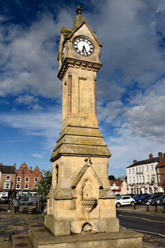 Evening light on Clock tower of Cotswold limestone in the Town Centre of Thirsk Market town, North Yorkshire, England - June 16, 2019