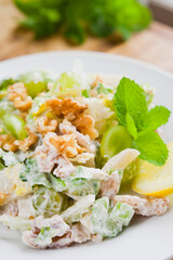 Waldorf salad with celery, apple, grapes and walnut.