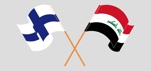 Crossed and waving flags of Finland and Iraq