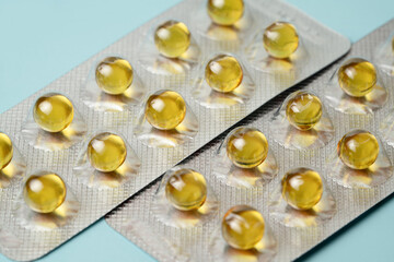 Close-up background. Capsules medicines fish oil.