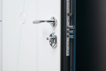 details in steel color in metal entrance door in white on the inside