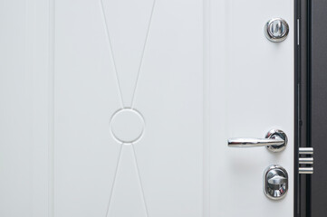 details in steel color in metal entrance door in white on the inside