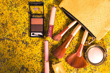 Make-up cosmetics in a gold purse