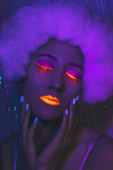 Portrait of sexy woman with neon makeup closeup. Art photo