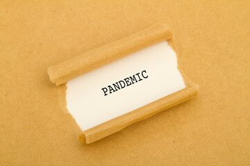 Pandemic written under torn paper.