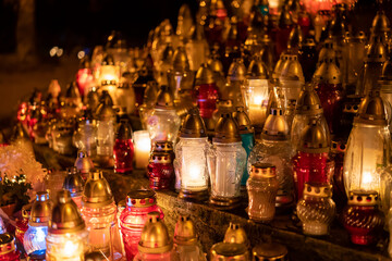 Candles on the grave. Cemetery.