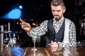 Barman concocts a cocktail at the beerhouse