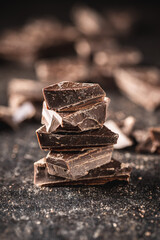 Pieces of chocolate bar. Broken dark chocolate