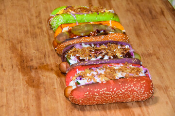 hot dogs assorted multi-colored buns different toppings