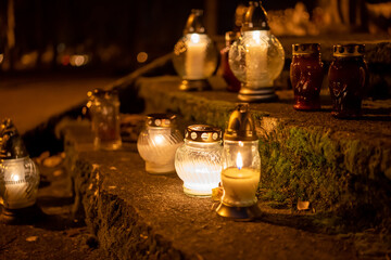 Candles on the grave. Cemetery.