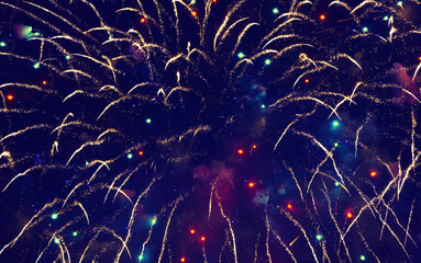 Beautiful blue Holiday background of golden fireworks