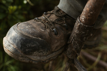 Boots stepping shovel ,farm work, gardening and agriculture close up