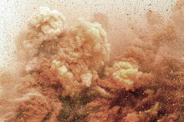 Close up of dust storm after detonator blast in the desert 