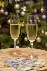 two glasses of champagne and money