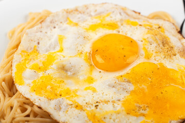 scrambled eggs with pasta on a plate