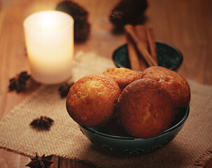 cinnamon muffin. The candle is on the table. New Year